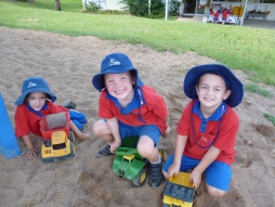 students playing in sand